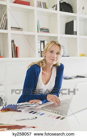Businesswoman choosing color swatches View Large Photo Image Stock Photo - Businesswoman choosing color swatches. Fotosearch