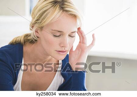 Close-up of a woman with head in hands View Large Photo Image Picture - Close-up of a woman with head in hands. Fotosearch