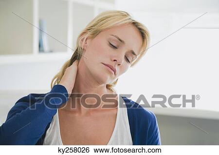 Stock Photograph - Woman touching her neck. Fotosearch