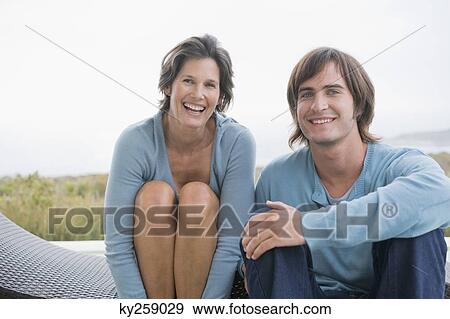 Stock Photo - Woman smiling with her son. Fotosearch