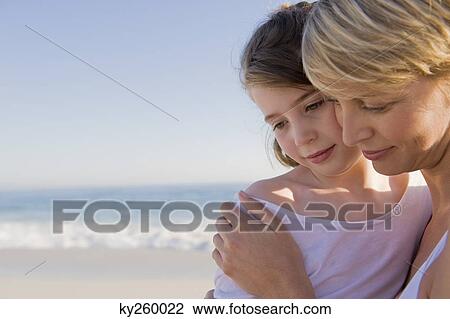Stock Image - Close-up of a woman with her daughter. Fotosearch