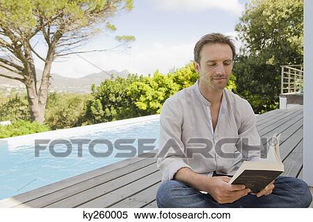 Man reading a book View Large Photo Image Stock Photography - Man reading a book. Fotosearch