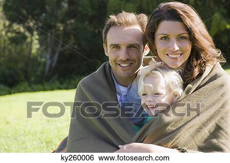 Portrait of a family smiling View Large Photo Image Stock Photograph - Portrait of a family smiling. Fotosearch