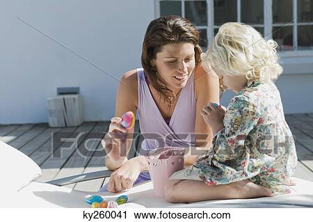 Woman playing with her daughter View Large Photo Image Stock Image - Woman playing with her daughter. Fotosearch
