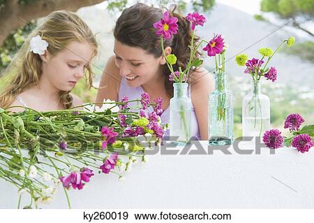 Woman smiling with her daughter View Large Photo Image Stock Photo - Woman smiling with her daughter. Fotosearch