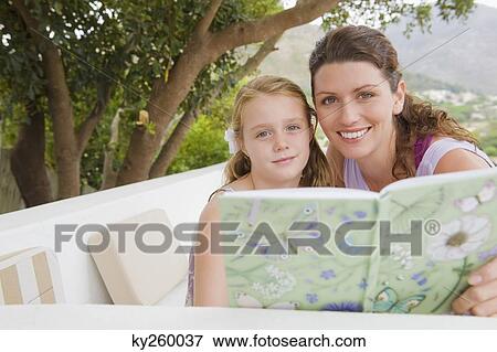 Stock Photo - Woman teaching her daughter. Fotosearch