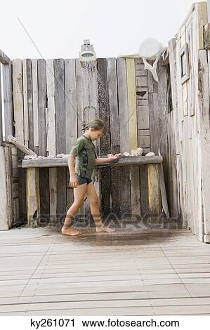 Boy under a beach shower View Large Photo Image Stock Image - Boy under a beach shower. Fotosearch