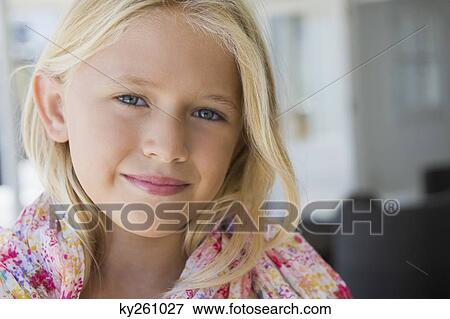 Close-up of a girl smiling View Large Photo Image Stock Photo - Close-up of a girl smiling. Fotosearch