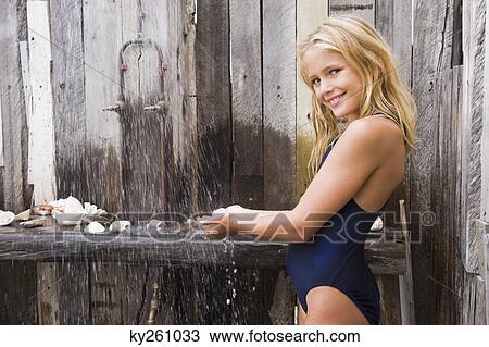 Portrait of a girl under a beach shower View Large Photo Image Stock Image - Portrait of a girl under a beach shower. Fotosearch