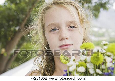 Portrait of a girl with flowers View Large Photo Image Stock Image - Portrait of a girl with flowers. Fotosearch