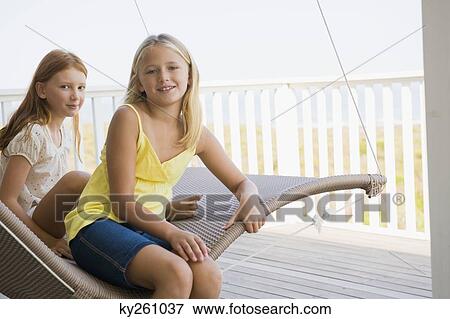 Two girls in a hammock View Large Photo Image Stock Photo - Two girls in a hammock. Fotosearch