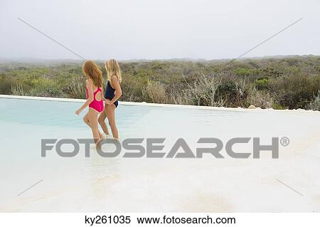 Stock Photography - Two girls in a swimming pool. Fotosearch