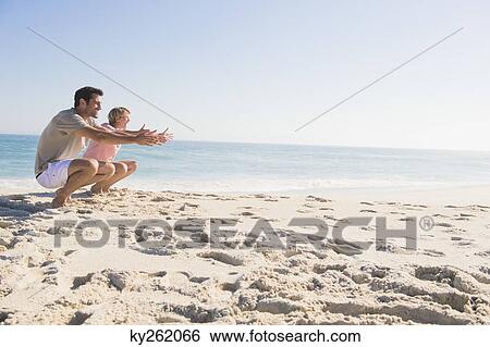 Couple enjoying vacations on the beach View Large Photo Image Stock Photograph - Couple enjoying vacations on the beach. Fotosearch