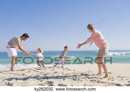 Family enjoying vacations on the beach View Large Photo Image Stock Image - Family enjoying vacations on the beach. Fotosearch