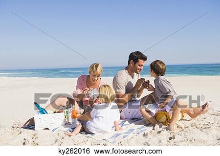 Family on vacations on the beach View Large Photo Image Stock Photograph - Family on vacations on the beach. Fotosearch