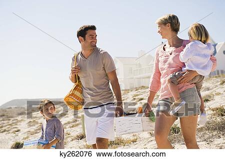 Family on vacations on the beach View Large Photo Image Stock Photograph - Family on vacations on the beach. Fotosearch
