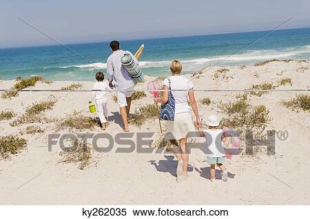 Stock Photography - Family on vacations on the beach. Fotosearch