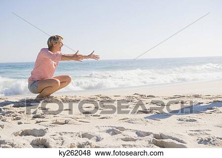 Woman enjoying vacations on the beach View Large Photo Image Stock Photo - Woman enjoying vacations on the beach. Fotosearch