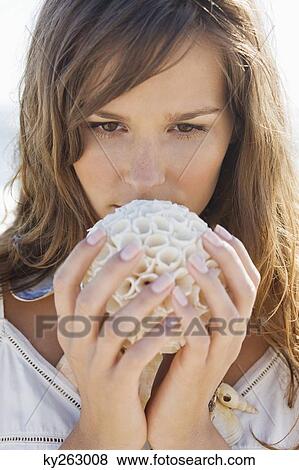 Close-up of a woman holding a sea sponge View Large Photo Image Stock Photo - Close-up of a woman holding a sea sponge. Fotosearch