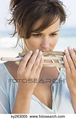 Close-up of a woman smelling sticks View Large Photo Image Stock Photography - Close-up of a woman smelling sticks. Fotosearch