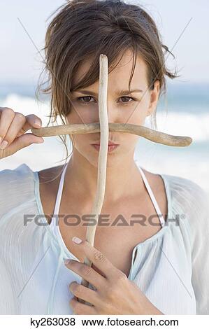 Woman making cross sign with sticks View Large Photo Image Stock Photo - Woman making cross sign with sticks. Fotosearch