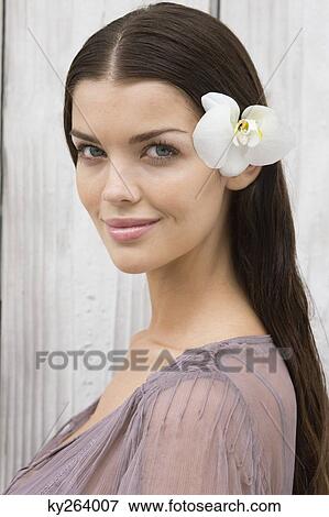Portrait of a woman wearing flowers View Large Photo Image Stock Photo - Portrait of a woman wearing flowers. Fotosearch