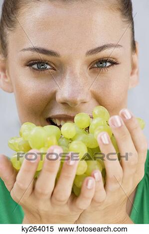Woman eating grapes View Large Photo Image Stock Photography - Woman eating grapes. Fotosearch