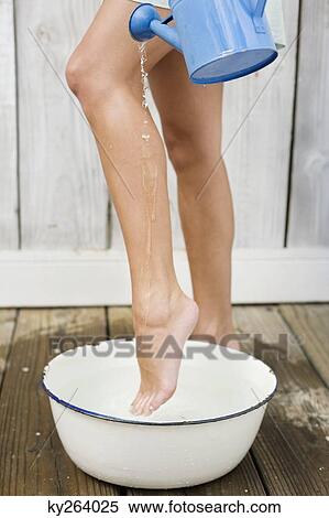 Woman washing legs in the bathroom View Large Photo Image Stock Photography - Woman washing legs in the bathroom. Fotosearch