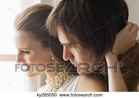 Stock Image - Couple embracing each other. Fotosearch