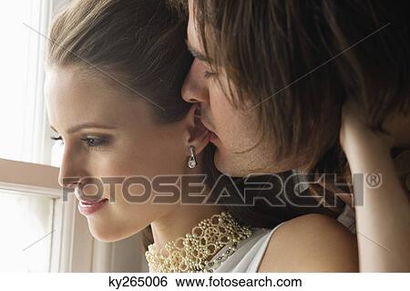 Couple embracing each other View Large Photo Image Stock Photograph - Couple embracing each other. Fotosearch