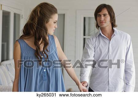 Couple holding hands of each other View Large Photo Image Stock Image - Couple holding hands of each other. Fotosearch