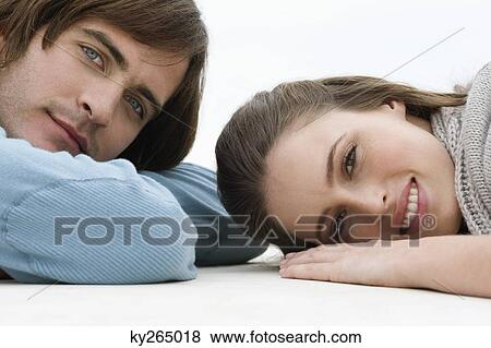 Stock Photo - Couple lying on the floor. Fotosearch
