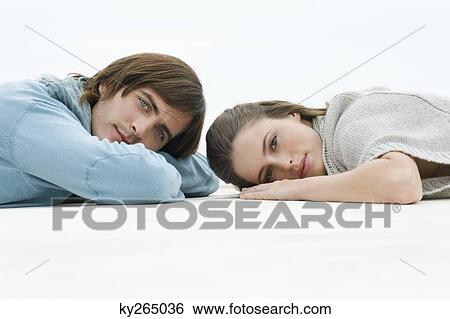 Couple lying on the floor View Large Photo Image Stock Photograph - Couple lying on the floor. Fotosearch