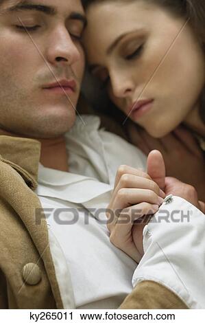 Couple resting on the bed View Large Photo Image Stock Image - Couple resting on the bed. Fotosearch