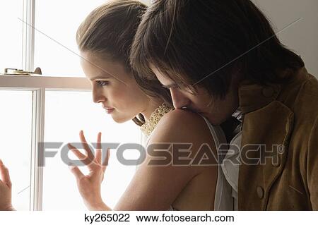 Man embracing a woman from behind View Large Photo Image Stock Image - Man embracing a woman from behind. Fotosearch