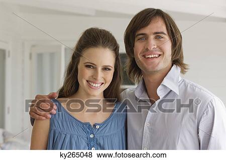 Portrait of a couple smiling View Large Photo Image Stock Photo - Portrait of a couple smiling. Fotosearch