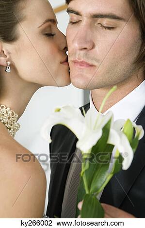 Bride kissing groom View Large Photo Image Stock Image - Bride kissing groom. Fotosearch