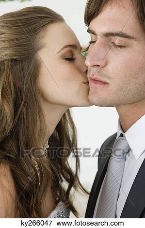 Bride kissing groom View Large Photo Image Stock Photo - Bride kissing groom. Fotosearch