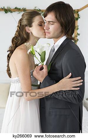 Bride kissing groom View Large Photo Image Stock Photo - Bride kissing groom. Fotosearch