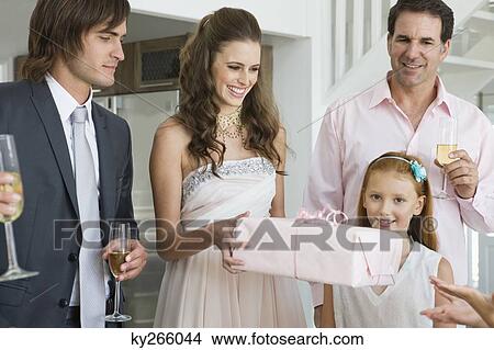 Bride receiving a gift from a guest in a party View Large Photo Image Picture - Bride receiving a gift from a guest in a party. Fotosearch