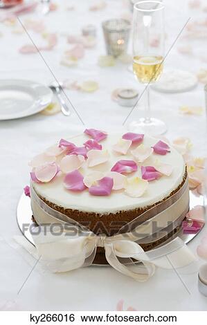 Close-up of a wedding cake on a dining table View Large Photo Image Stock Photograph - Close-up of a wedding cake on a dining table. Fotosearch