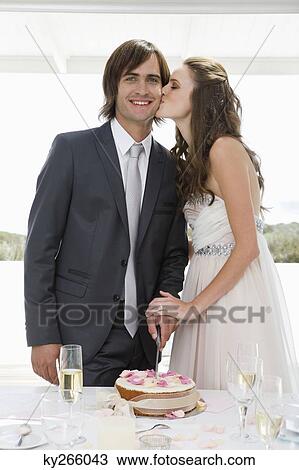 Newlywed couple celebrating at a wedding party View Large Photo Image Stock Image - Newlywed couple celebrating at a wedding party. Fotosearch