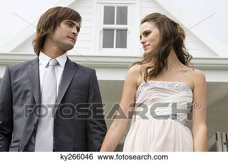 Newlywed couple looking at each other View Large Photo Image Stock Photograph - Newlywed couple looking at each other. Fotosearch