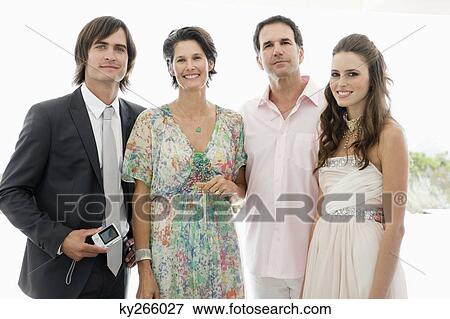 Newlywed couple with their parents View Large Photo Image Stock Photo - Newlywed couple with their parents. Fotosearch