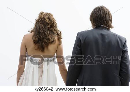 Rear view of a newlywed couple View Large Photo Image Stock Image - Rear view of a newlywed couple. Fotosearch