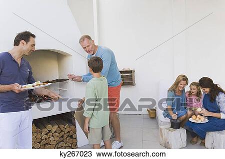 Family cooking food View Large Photo Image Stock Image - Family cooking food. Fotosearch