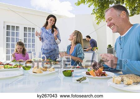 Family having breakfast at the dining table View Large Photo Image Stock Image - Family having breakfast at the dining table. Fotosearch