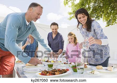 Family having breakfast at the dining table View Large Photo Image Stock Image - Family having breakfast at the dining table. Fotosearch