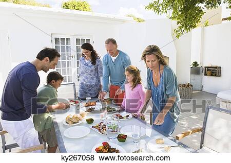 Family having breakfast at the dining table View Large Photo Image Stock Photo - Family having breakfast at the dining table. Fotosearch