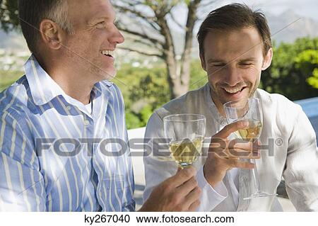 Two friends drinking white wine View Large Photo Image Stock Image - Two friends drinking white wine. Fotosearch
